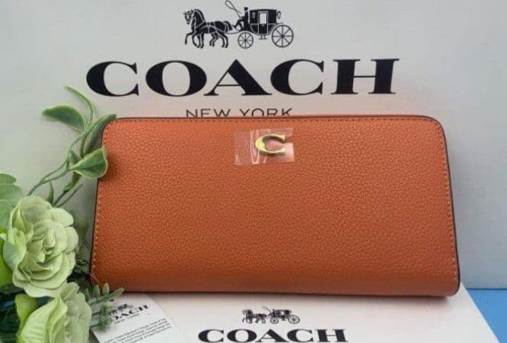 新品未使用コーチ長財布オレンジロングジップレディースメンズ送料無料