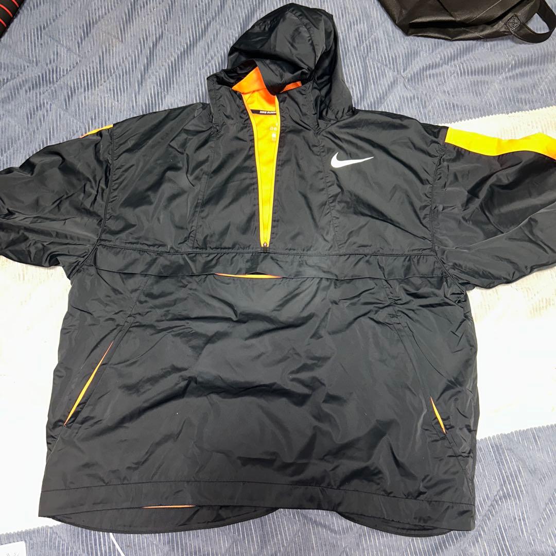 Nike フード付きナイロンジャケット ブラック/オレンジ - メルカリ