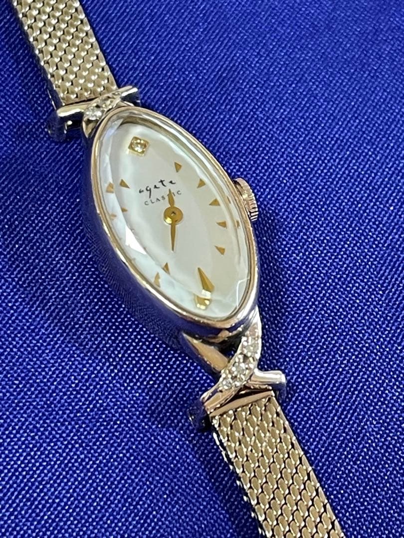 agete アガット オーバルフェイス ジュエリーウォッチ ダイヤ シェル